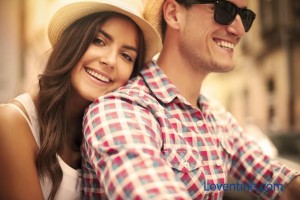 Close up of loving couple riding on bike in the city